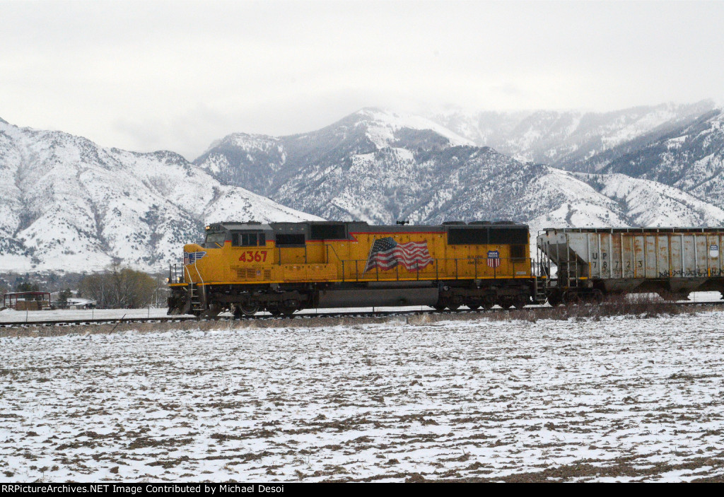 UP SD70M #4367 leads the northbound Cache Valley Local (LCG-41C) approaching the Airport Rd. Xing in Logan, Utah. April 13, 2022